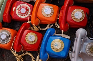 lot of multi-colored rotary phones